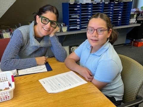 student reading with Higher Steps tutor
