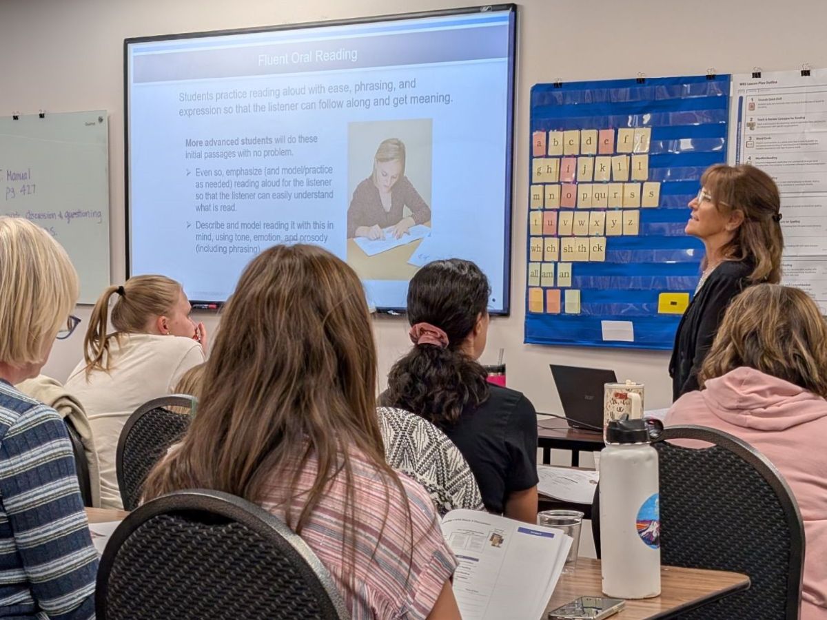 Clinic staff conducting a Wilson training with educators